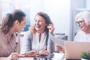 Best age for a facelift. Three generations of women working in the office.