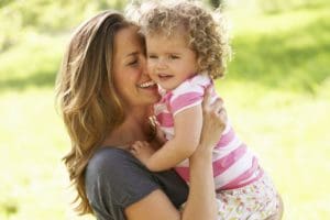 Davis - Mother Carrying Young Daughter Through Summer Field